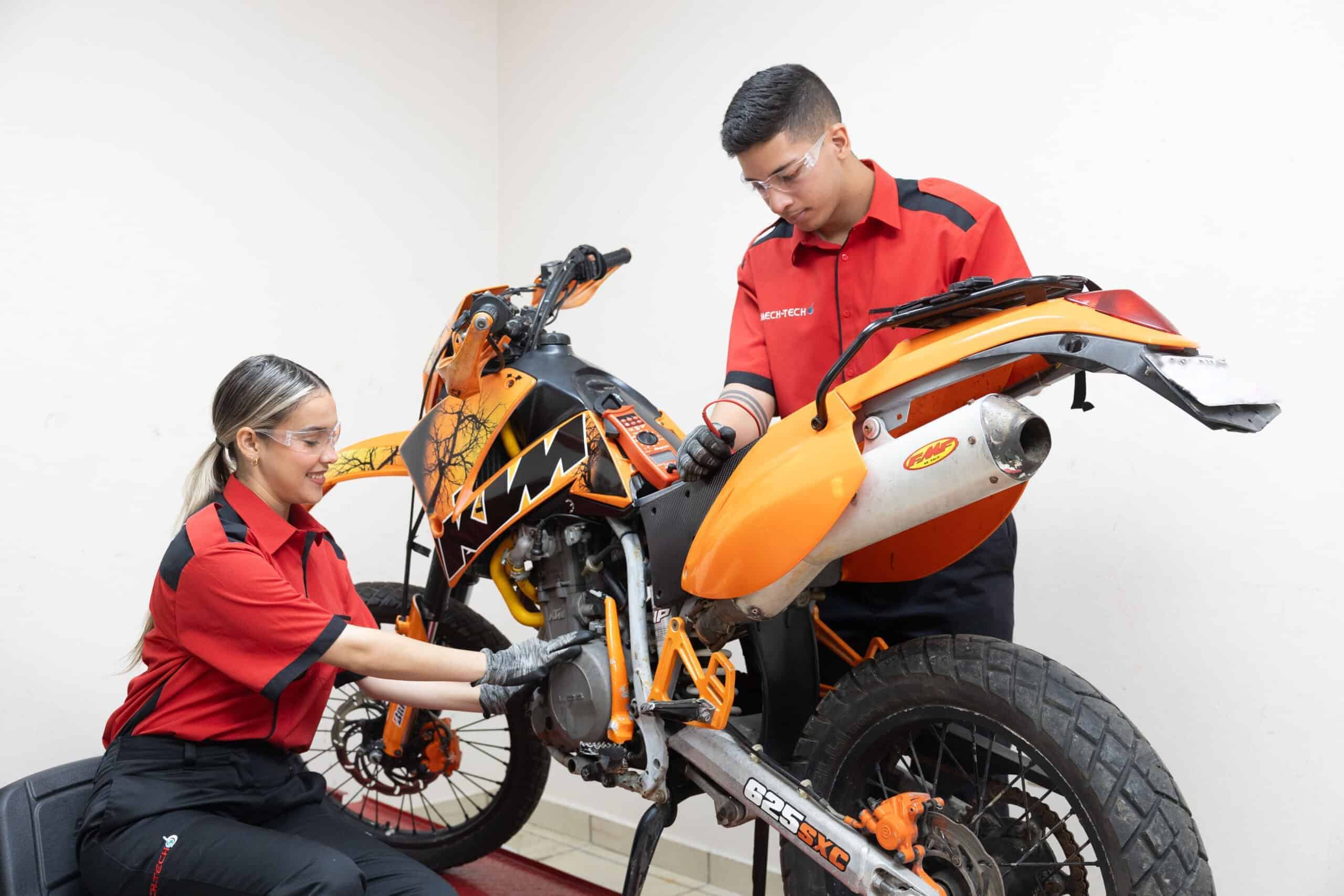 Motorcycle Mechanics students working on a motorcycle
